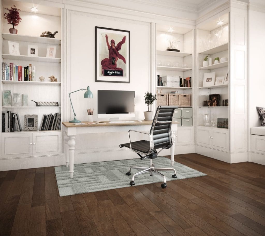 Modern home office with white shelves and a sleek desk setup.